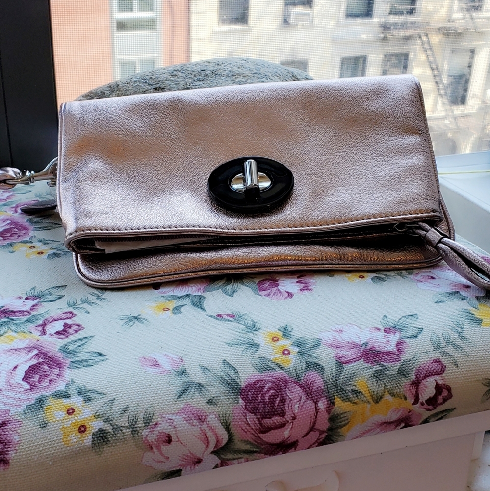 Coach wristlet with rose gold coating